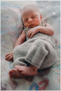 Newborn-baby-snoozing-in-cute-knitted-outfit-gold-coast-newborn-documentary-photography