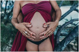 full-belly-bump-in-the-hands-of-both-mum-and-dad-Gold-Coast-Beach-Maternity-photography