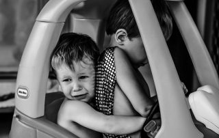 two-toddlers-fighting-over-who-will-drive-the-toy-car-candid-family-documentary-photography-gold-coast-australia