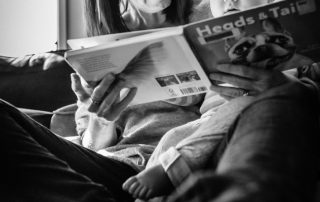 mother reading a book to her 1 year old daughter fully enthralled and engaged