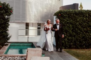 blog-image-Bride-being-walked-down-the-aisle-by-her-dad-Peppers-Garden-Terrace-gold-coast