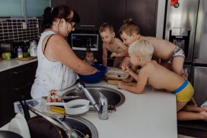 Grandma-teaching-grandkids-how-to-make-christmas-shortbread-gold-coast-australia