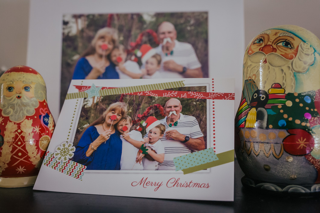 image-showing-grandparents-with-crazy-grandkids-using-hold-them-up-xmas-decorations-which-was-mad-into-a-christmas-card-which-is-displayed