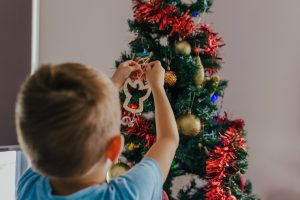 young-boy-hanging-an-angle-on-the-xmas-tree