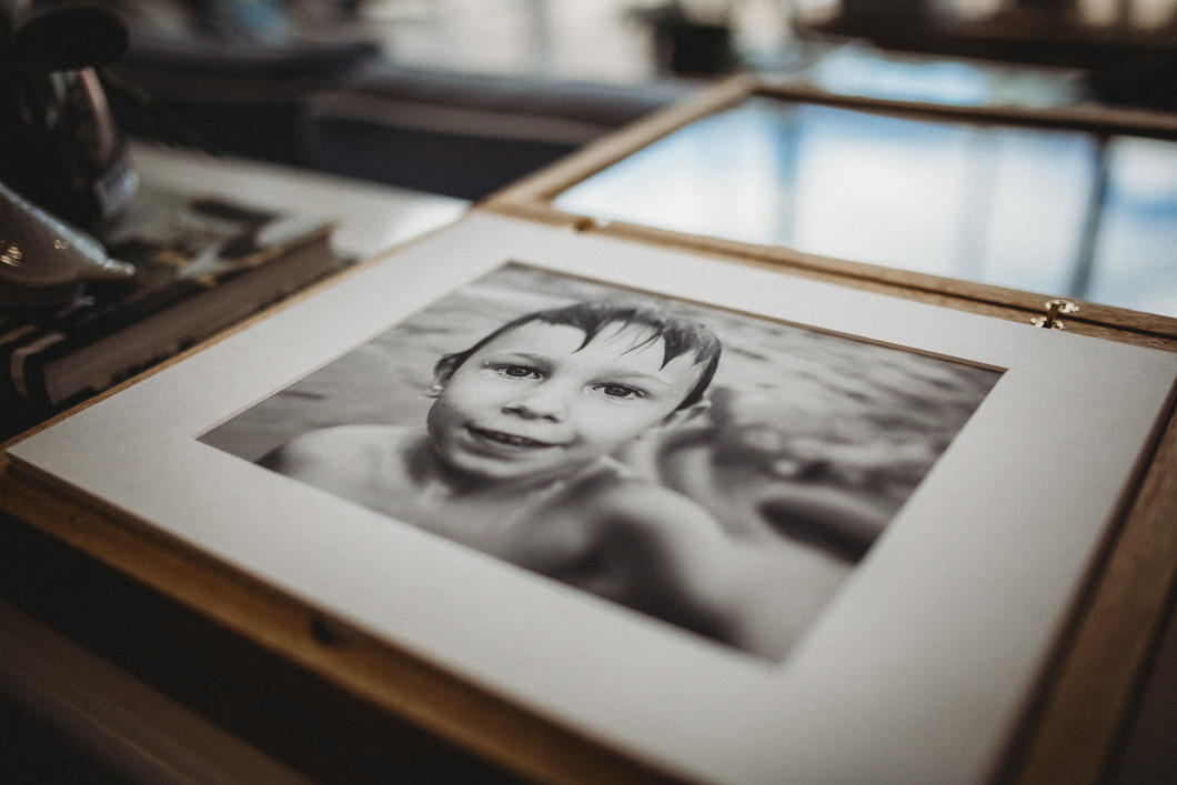 beautiful-matted-photograph-of-little-boy-reaching-towards-photographer-displayed-in-unqiue-wooden-story-box